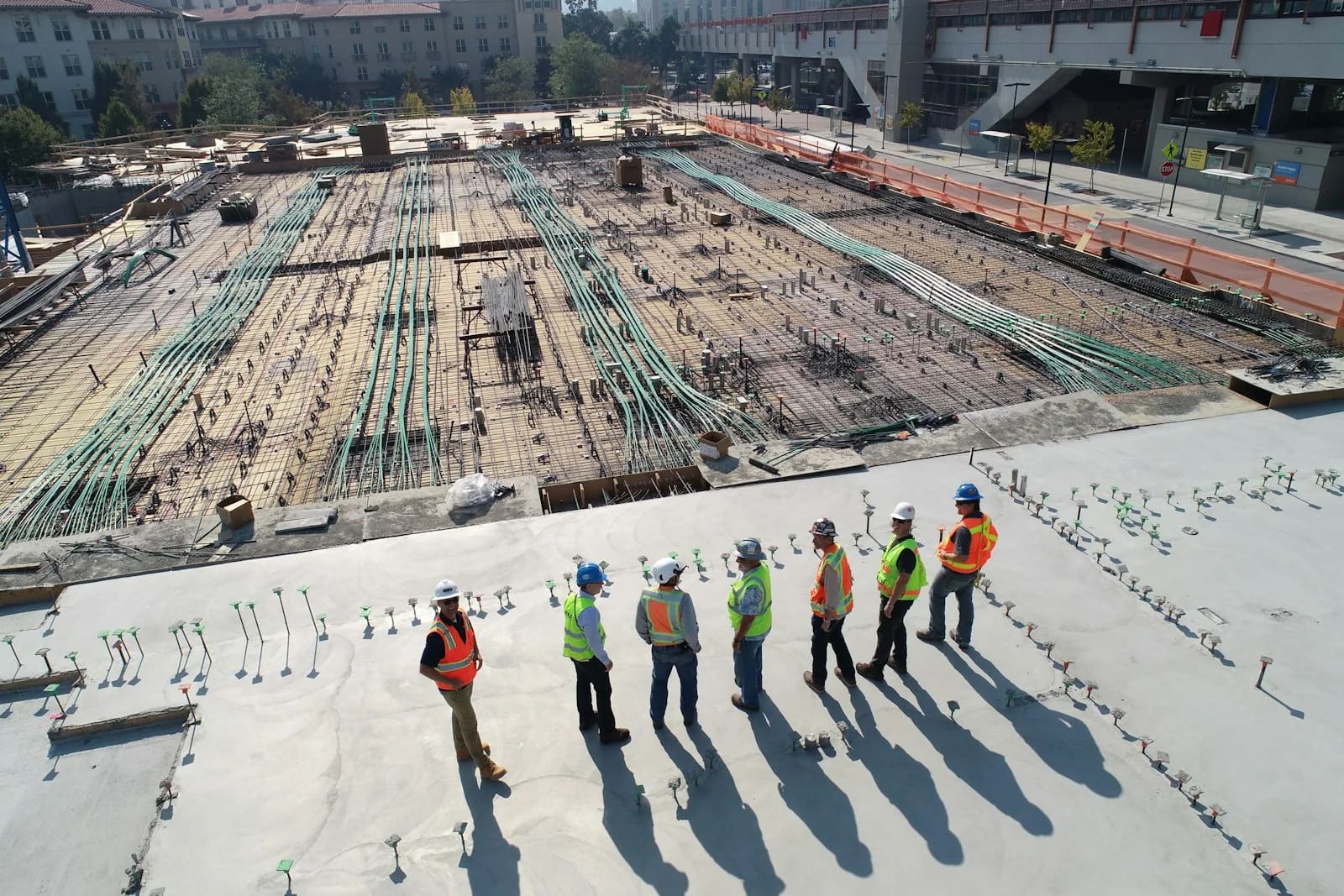 Site team reviewing reinforcement and works in progress during construction