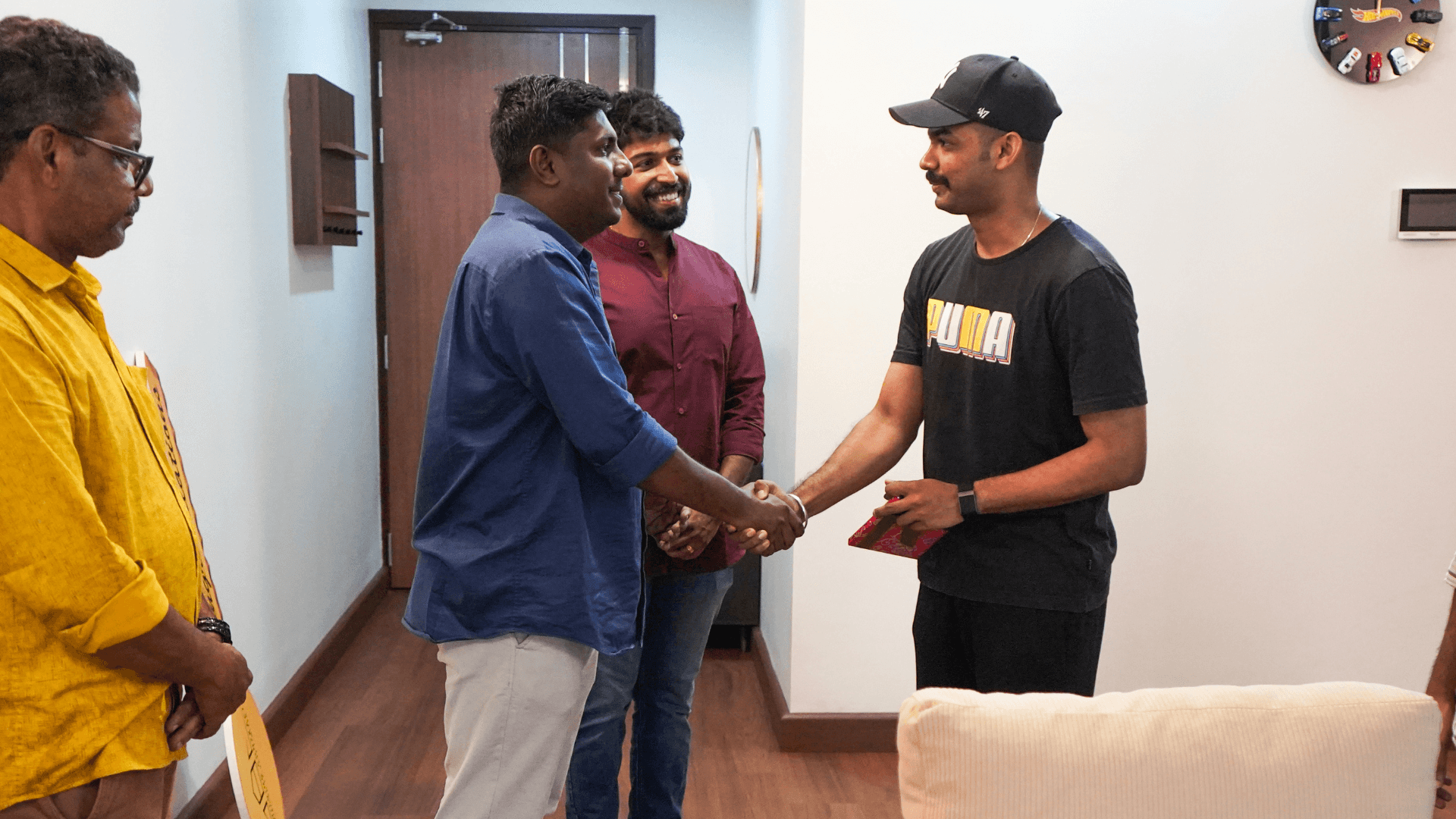 Completion handshake at Mathew Thomas apartment handover