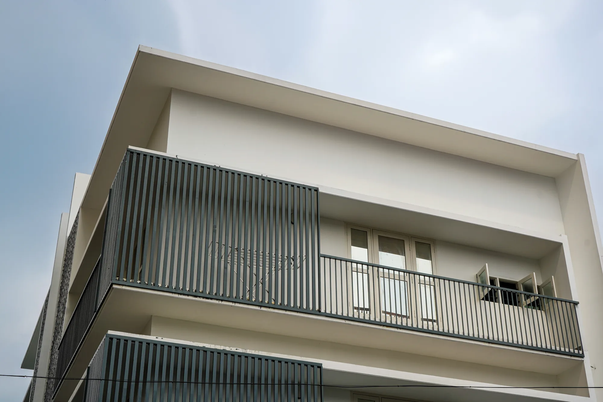 Upward view of the Ratheesh Apartments facade