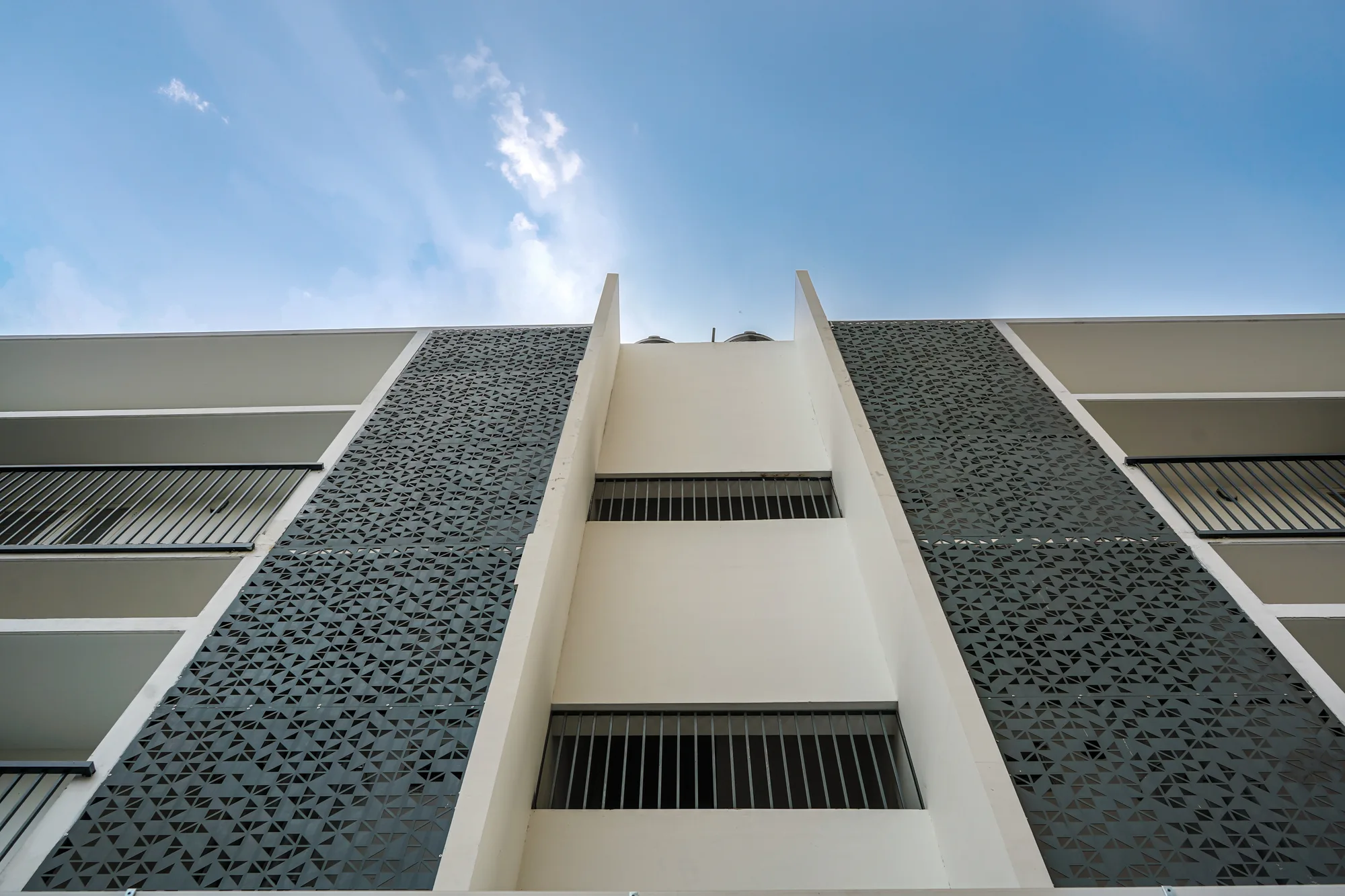 Perforated vertical screen detail at Ratheesh Apartments