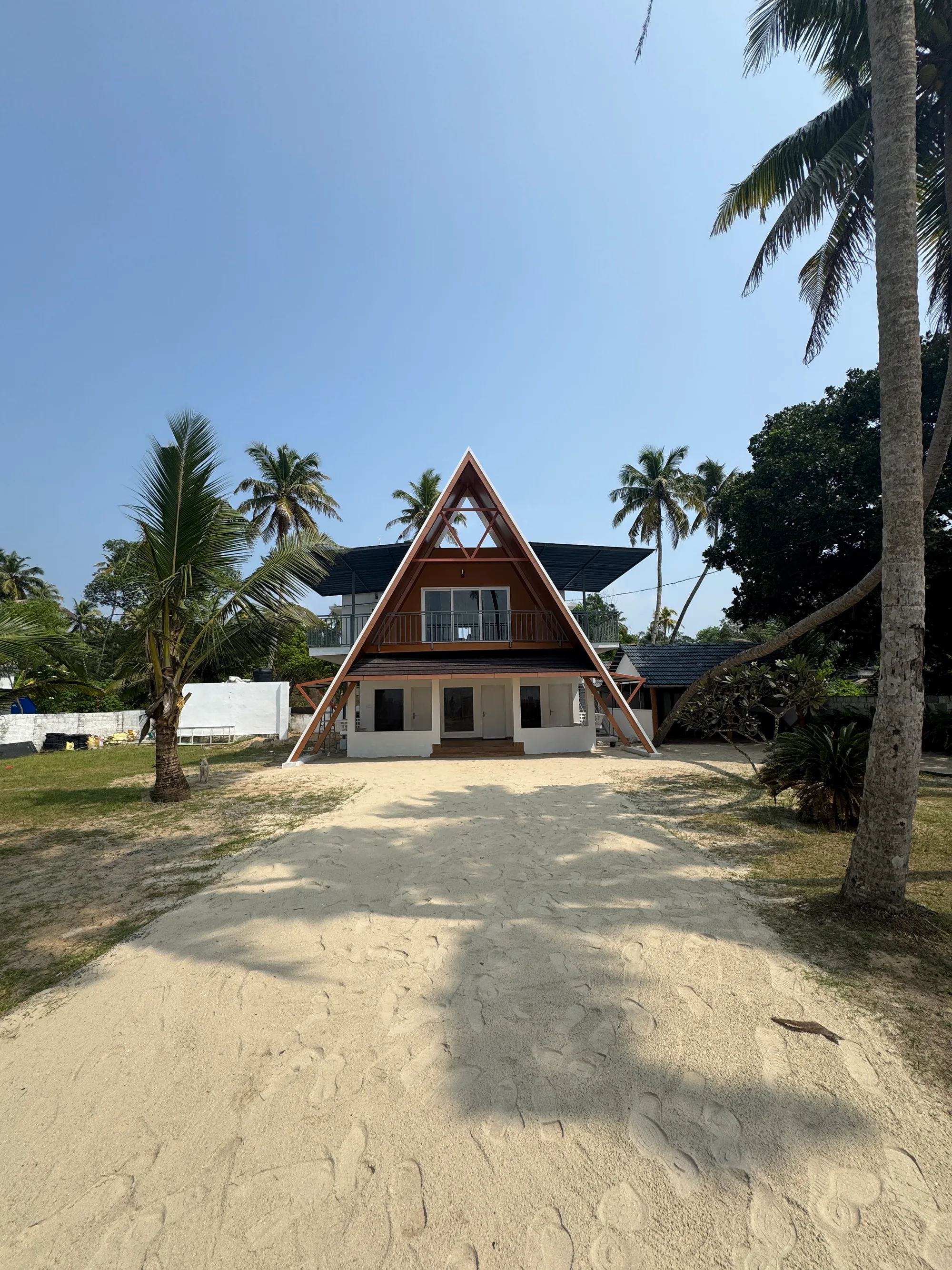 Front elevation of the rehabilitated A-frame resort at Sailor Home