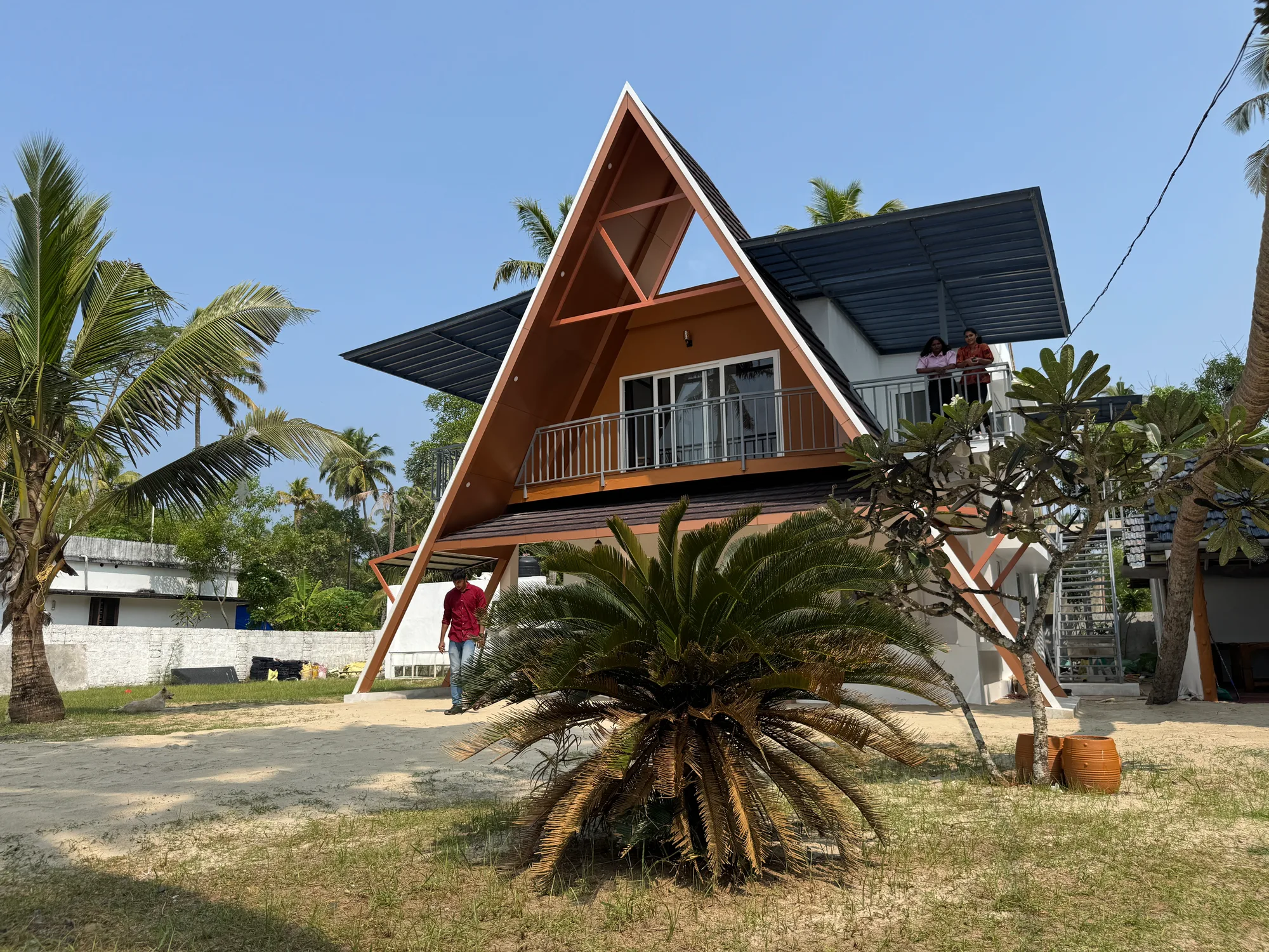 A-frame facade with upper balconies facing the sea at Sailor Home